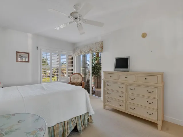 a bedroom with a bed and a cabinets