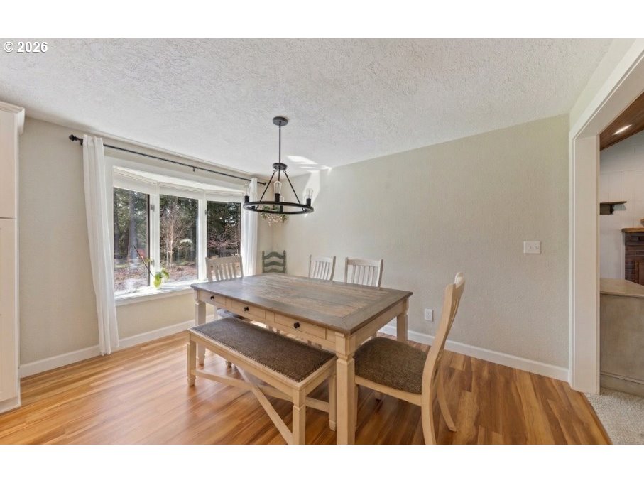 7624 Shady Way Southeast Turner, OR 97392 - Photo 16 of 48 a dining room with furniture and window