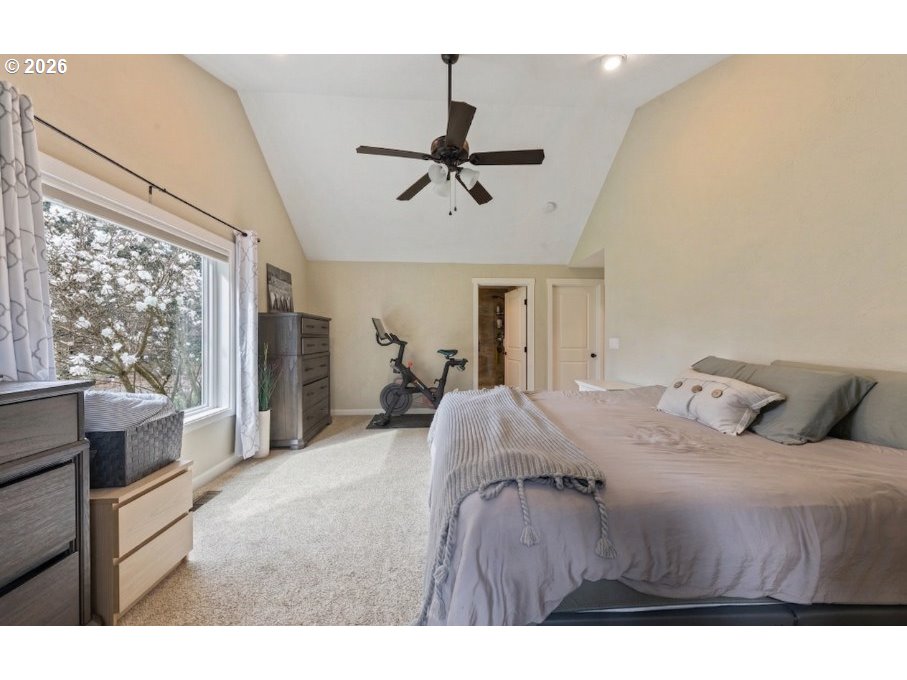 7624 Shady Way Southeast Turner, OR 97392 - Photo 20 of 48 a bed room with a bed window and a chandelier