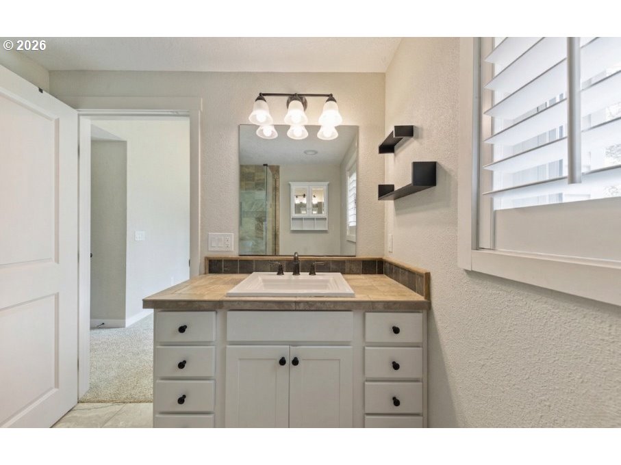 7624 Shady Way Southeast Turner, OR 97392 - Photo 21 of 48 a bathroom with a sink and a mirror