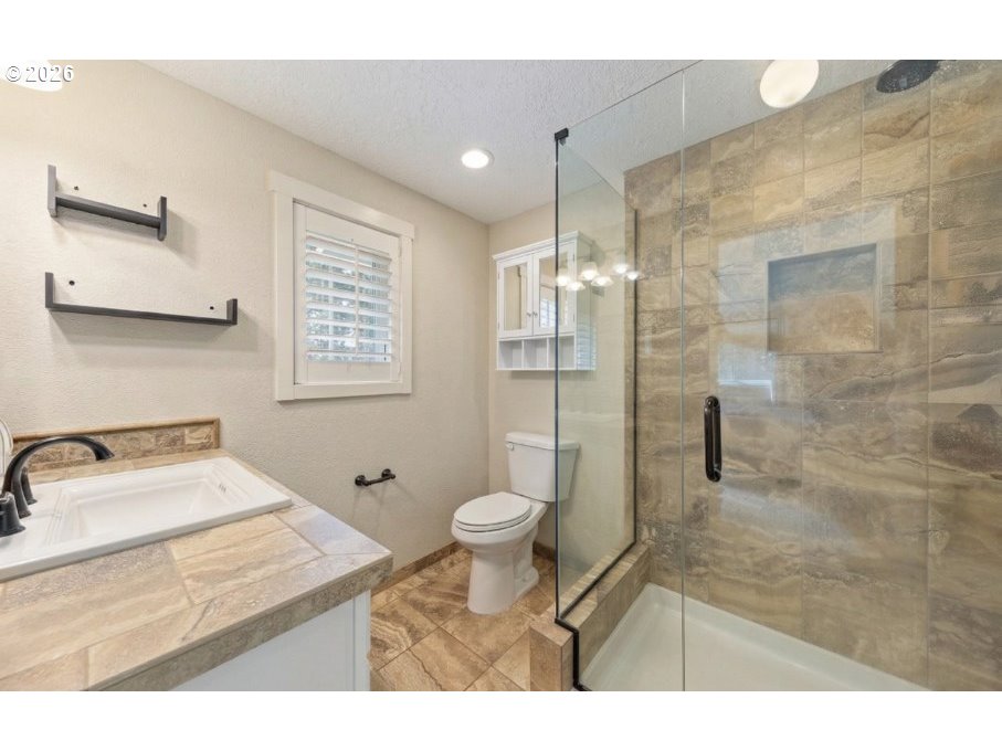 7624 Shady Way Southeast Turner, OR 97392 - Photo 22 of 48 a bathroom with a toilet sink and a shower
