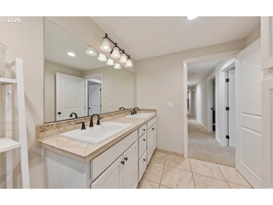 7624 Shady Way Southeast Turner, OR 97392 - Photo 29 of 48 a bathroom with a sink vanity and a mirror