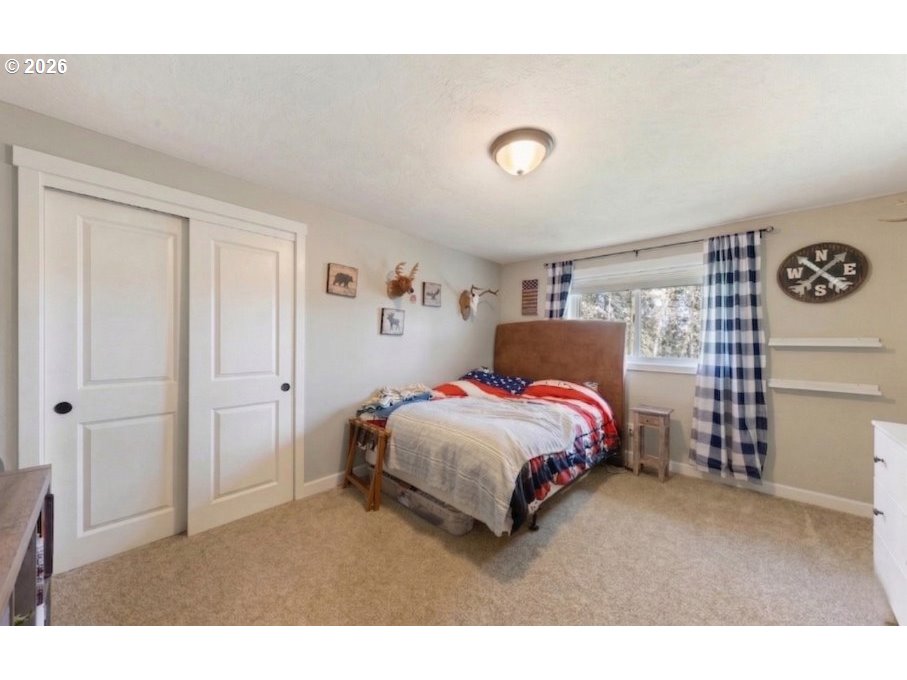 7624 Shady Way Southeast Turner, OR 97392 - Photo 30 of 48 a bedroom with a bed and a cabinets