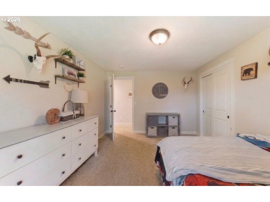 7624 Shady Way Southeast Turner, OR 97392 - Photo 31 of 48 a bedroom with a bed and a dresser