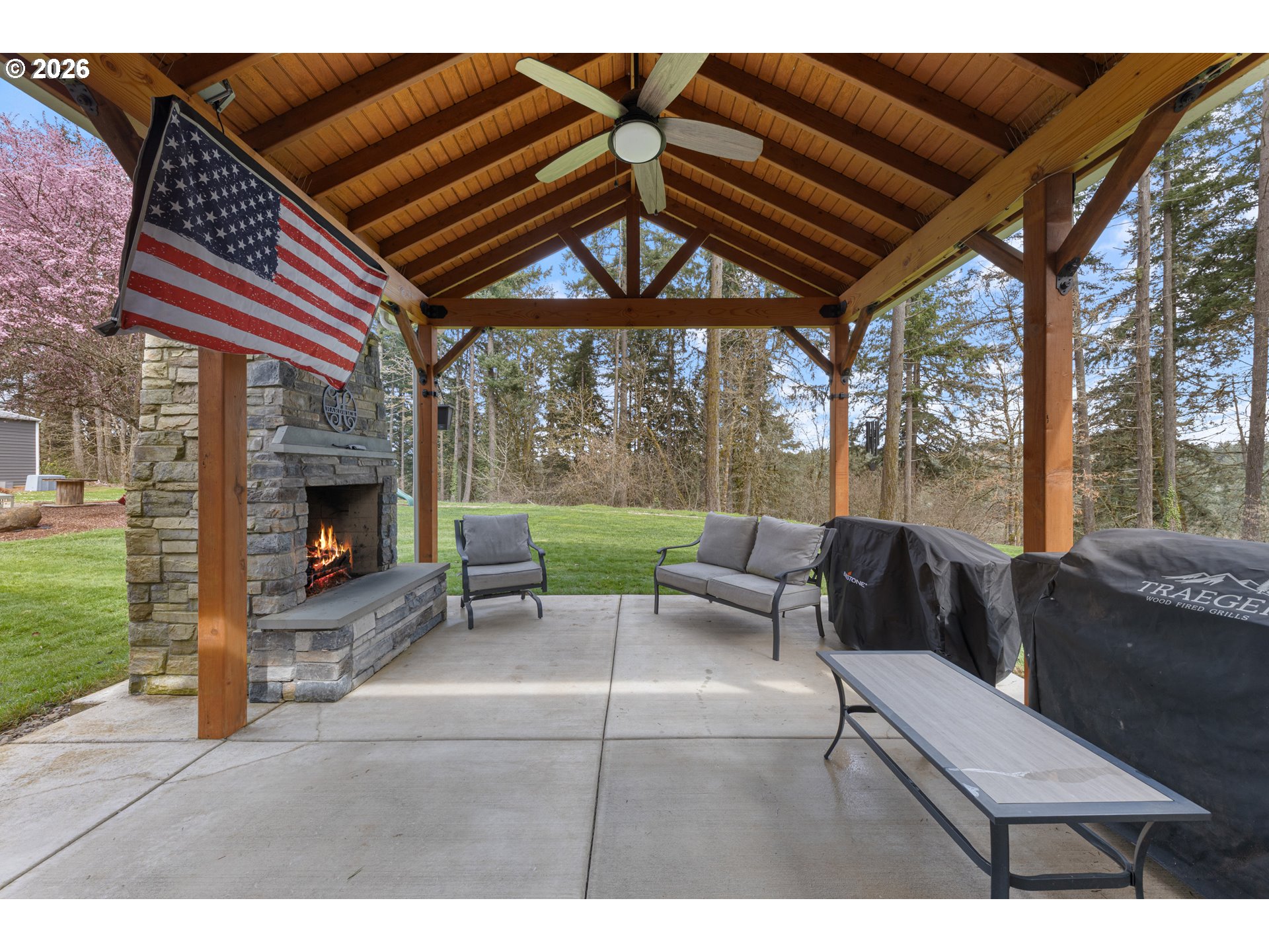7624 Shady Way Southeast Turner, OR 97392 - Photo 36 of 48 a outdoor living space with furniture and a fireplace