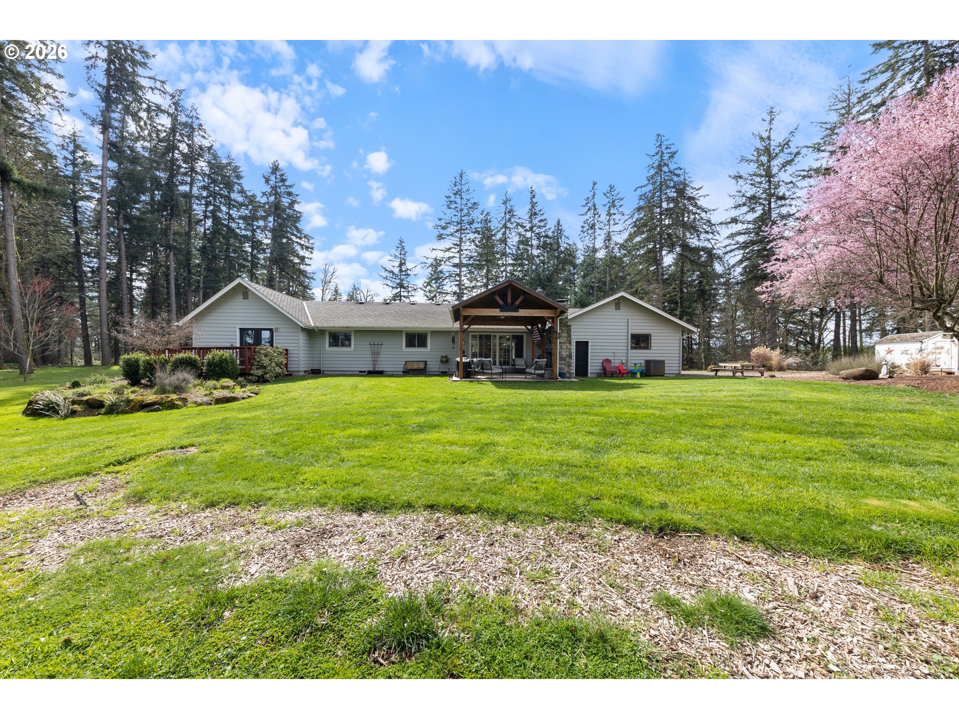 7624 Shady Way Southeast Turner, OR 97392 - Photo 39 of 48 a view of a white house with a big yard and large trees