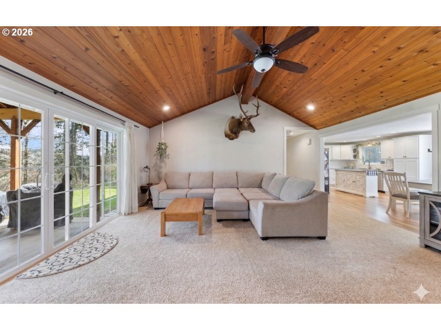 7624 Shady Way Southeast Turner, OR 97392 - Photo 7 of 48 a living room with furniture and a floor to ceiling window