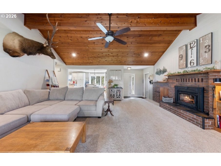 7624 Shady Way Southeast Turner, OR 97392 - Photo 9 of 48 a living room with furniture and a fireplace