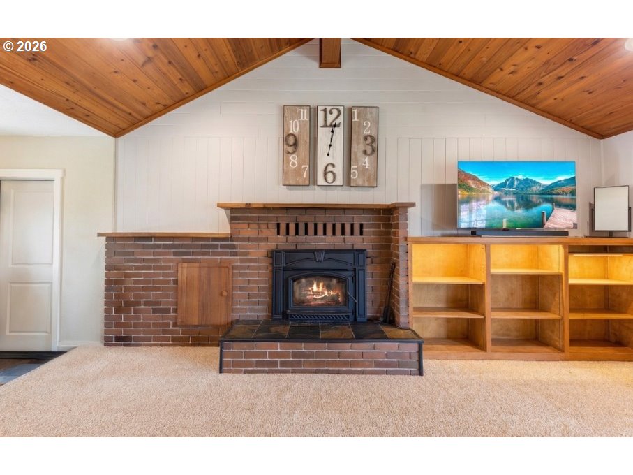 7624 Shady Way Southeast Turner, OR 97392 - Photo 10 of 48 a living room with furniture and a fireplace