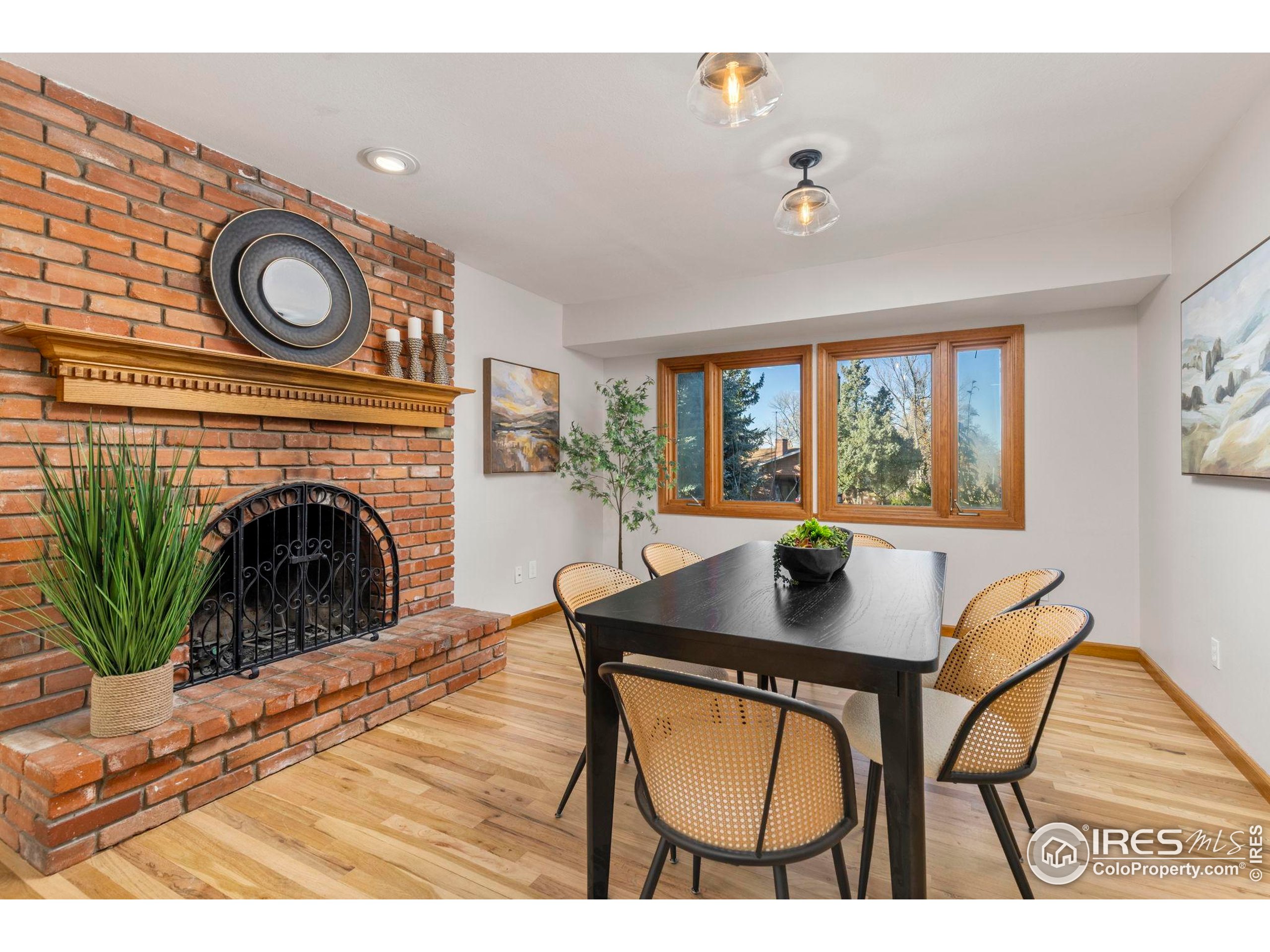 7238 Mt Sherman Road Longmont, CO 80503 - Photo 13 of 48 a living room with furniture a fireplace and a large window