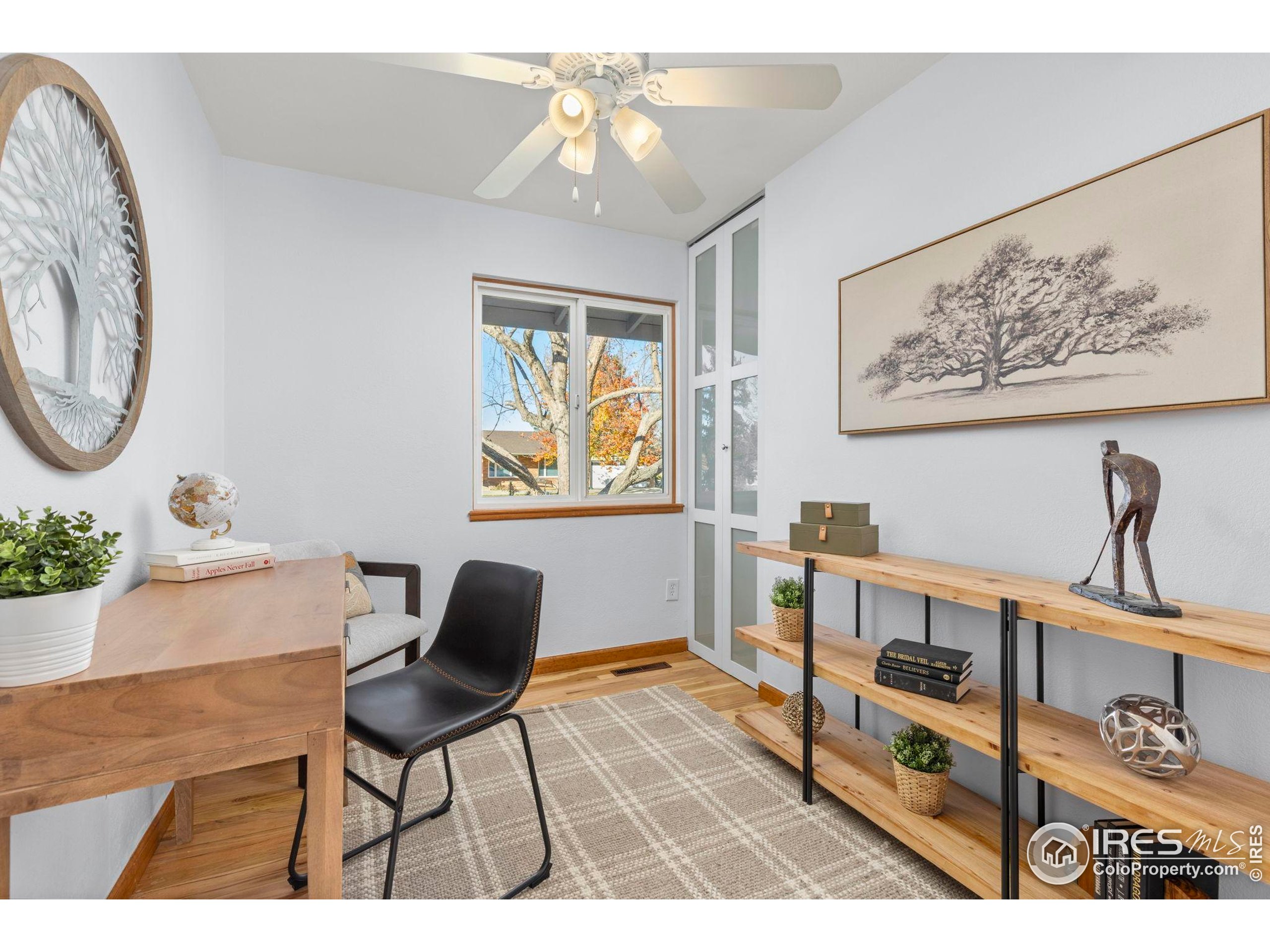7238 Mt Sherman Road Longmont, CO 80503 - Photo 20 of 48 a living room with furniture a dining table with wooden floor