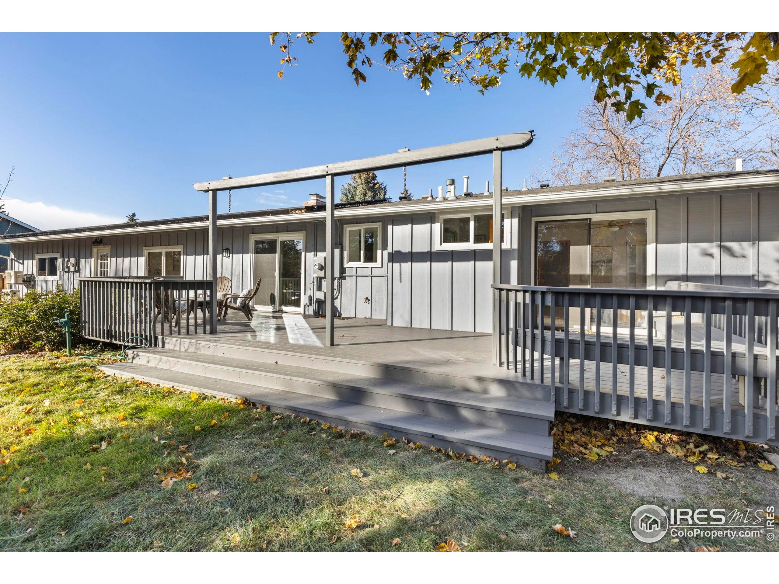 7238 Mt Sherman Road Longmont, CO 80503 - Photo 33 of 48 a view of a house with backyard and porch
