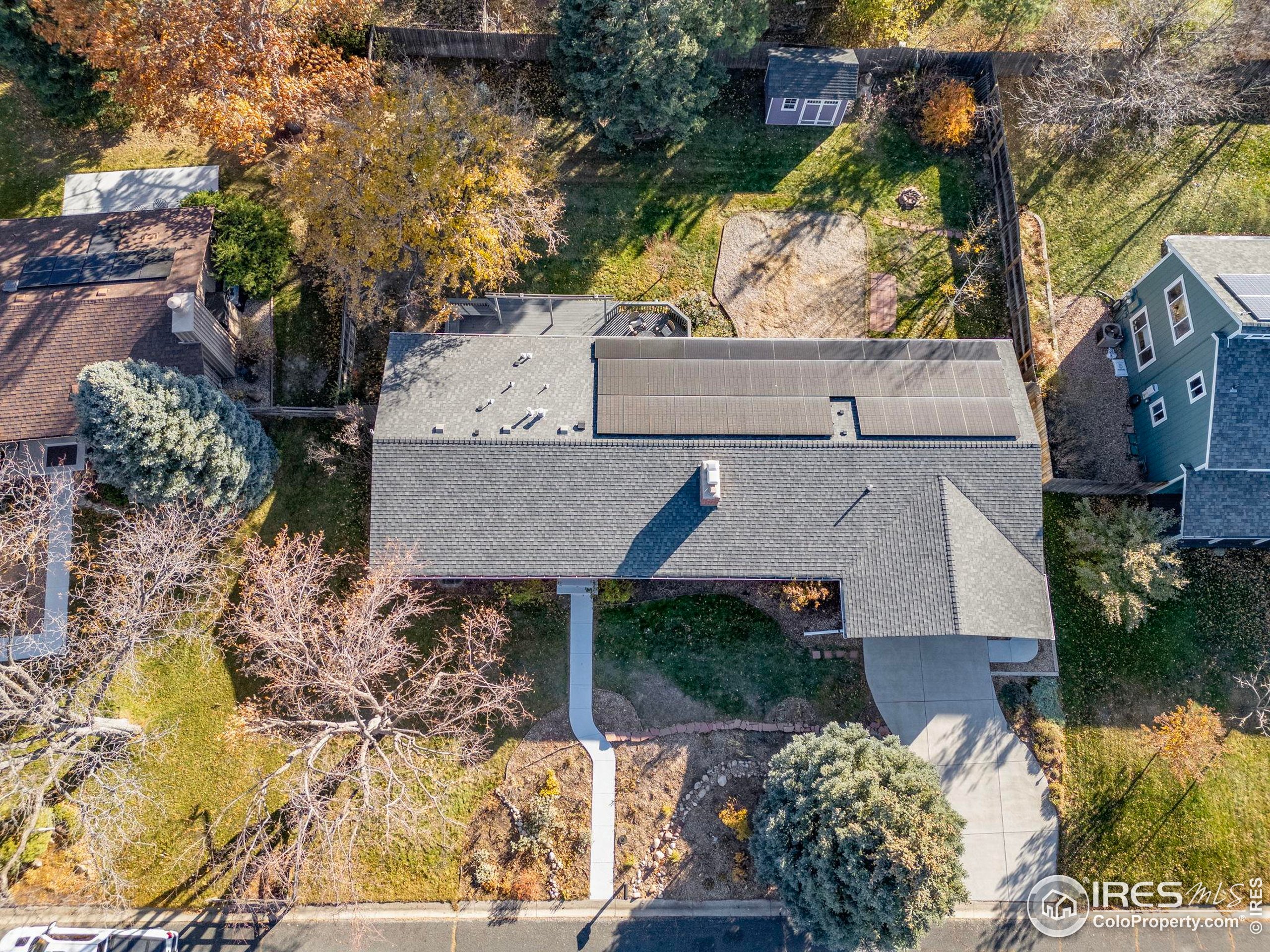 7238 Mt Sherman Road Longmont, CO 80503 - Photo 40 of 48 an aerial view of a house with a yard and large trees