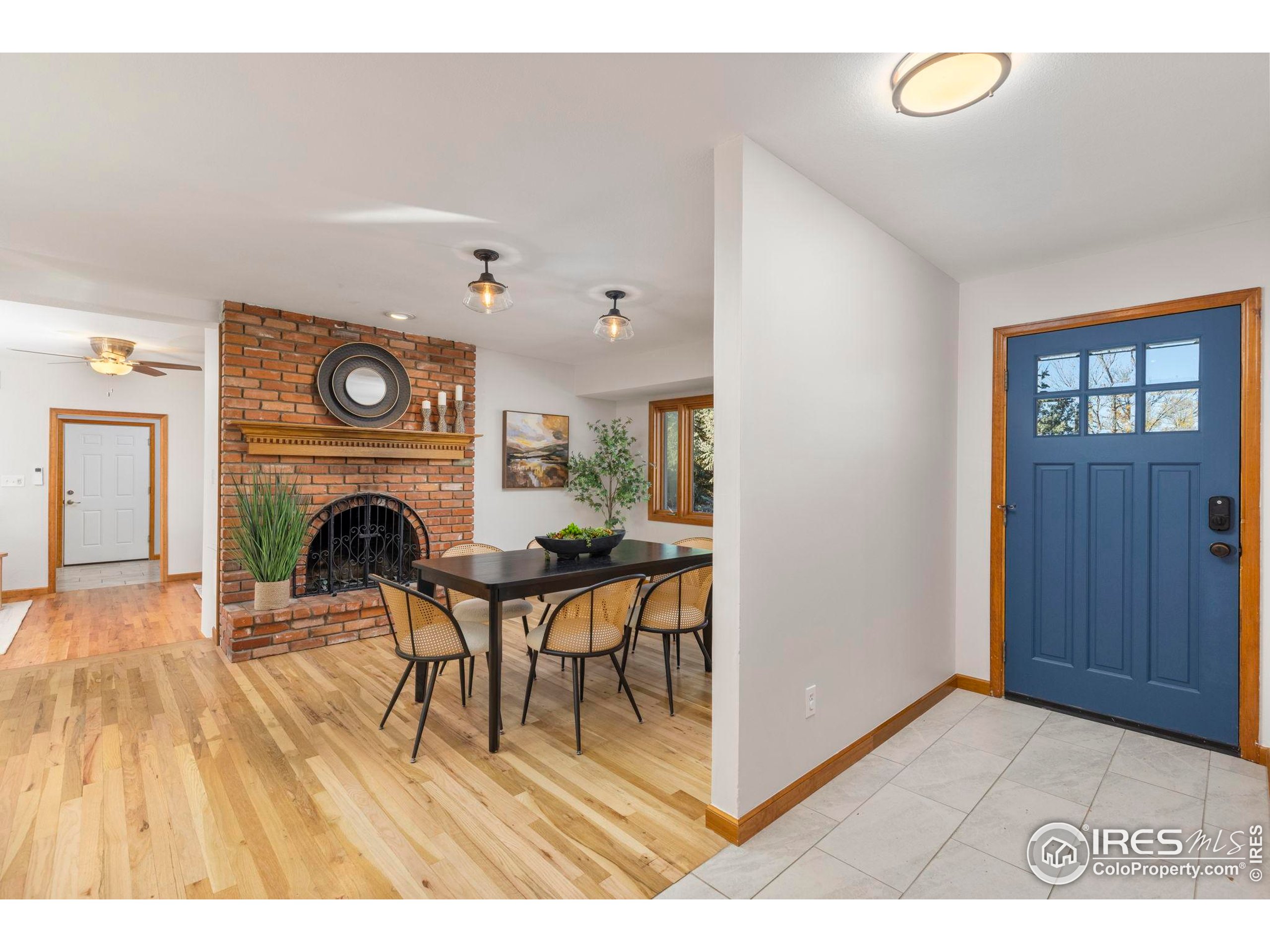 7238 Mt Sherman Road Longmont, CO 80503 - Photo 7 of 48 a living room with furniture and a fireplace