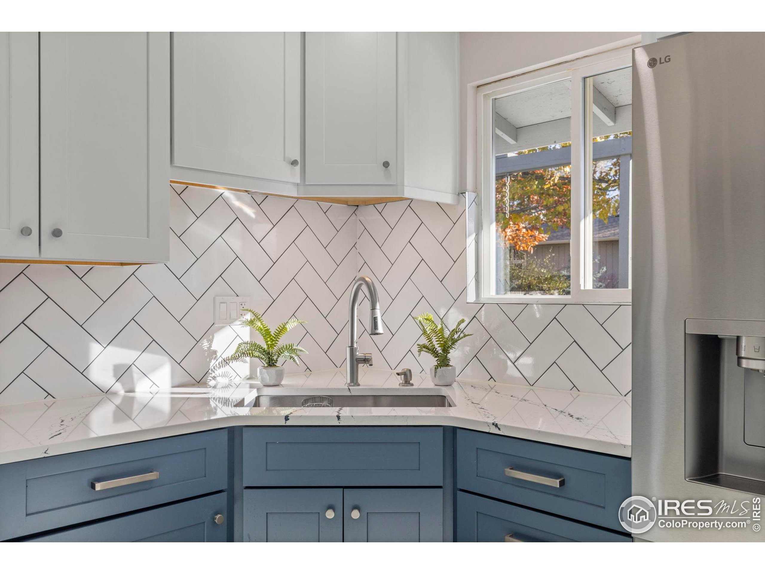 7238 Mt Sherman Road Longmont, CO 80503 - Photo 10 of 48 a bathroom with a sink a mirror and next to a window