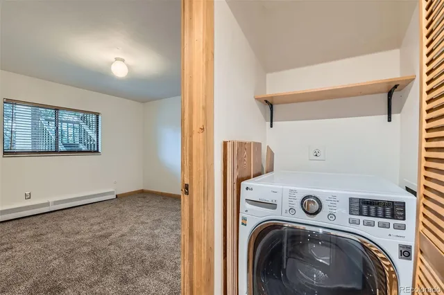 a view of storage and utility room with washer and dryer