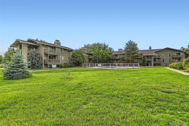 a view of a house with a big yard