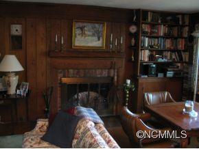 390 Sourwood Ridge Road Tryon, NC 28782 - Photo 3 of 6 a living room with furniture and a fireplace