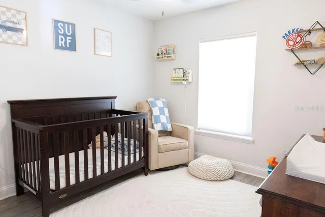 a bedroom with a bed and window