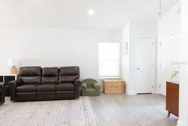 a living room with furniture and a window