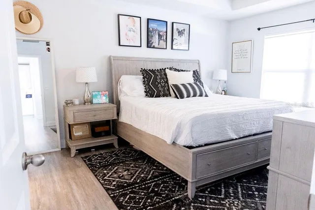 a bedroom with a bed and a window