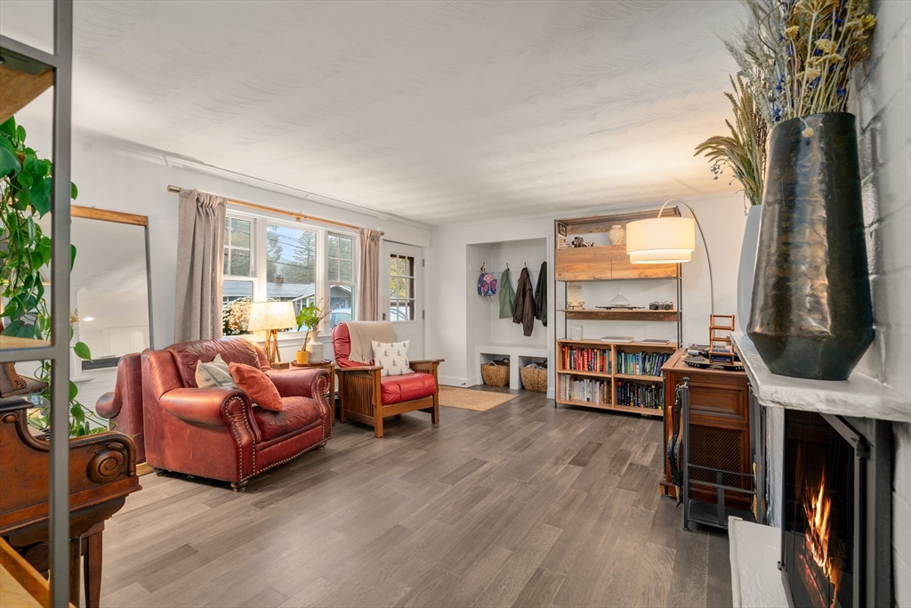 62 Gregory Road Framingham, MA 01701 - Photo 1 of 42 a living room with furniture a flat screen tv and a large window