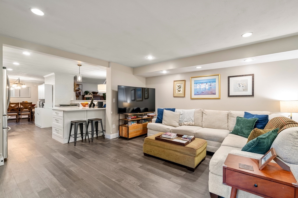 62 Gregory Road Framingham, MA 01701 - Photo 15 of 42 a living room with furniture kitchen view and a wooden floor