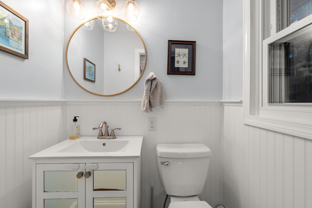 62 Gregory Road Framingham, MA 01701 - Photo 24 of 42 a bathroom with a sink mirror and toilet