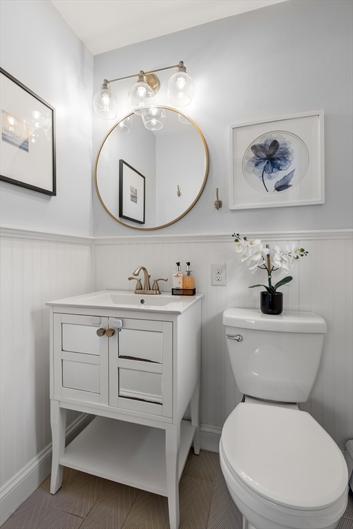 62 Gregory Road Framingham, MA 01701 - Photo 28 of 42 a bathroom with a toilet a sink and a mirror