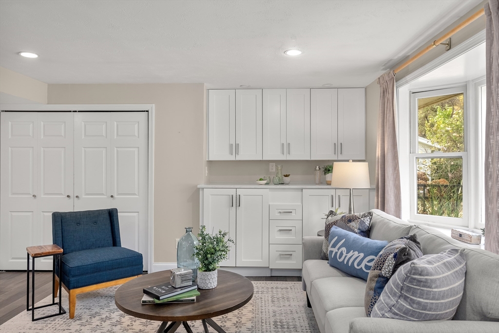 62 Gregory Road Framingham, MA 01701 - Photo 33 of 42 a living room with furniture and a potted plant