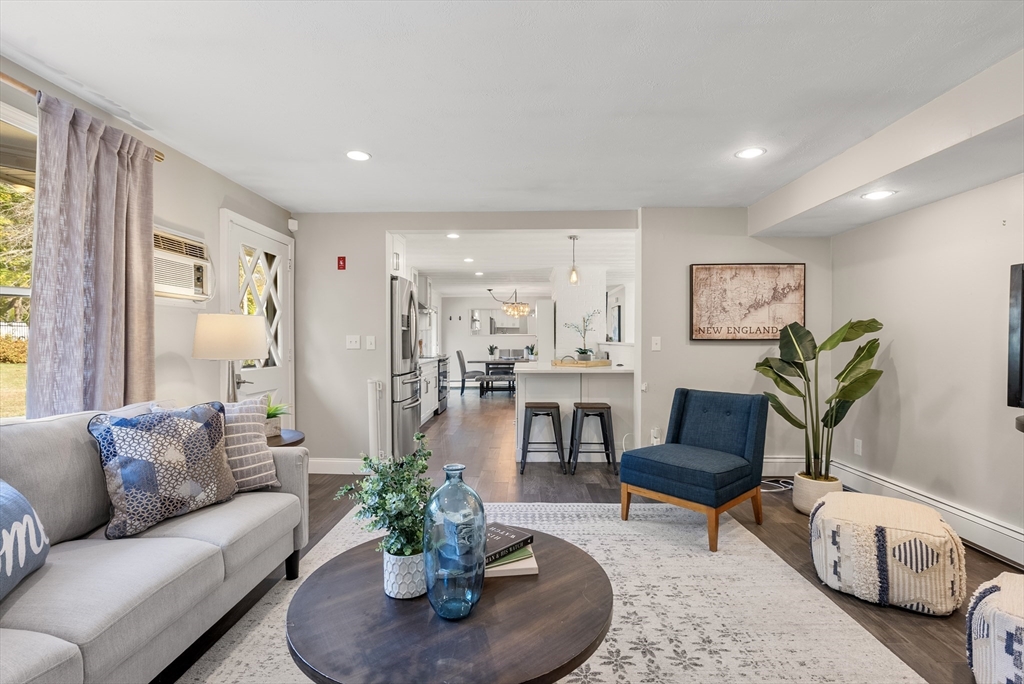 62 Gregory Road Framingham, MA 01701 - Photo 34 of 42 a living room with furniture potted plant and a window