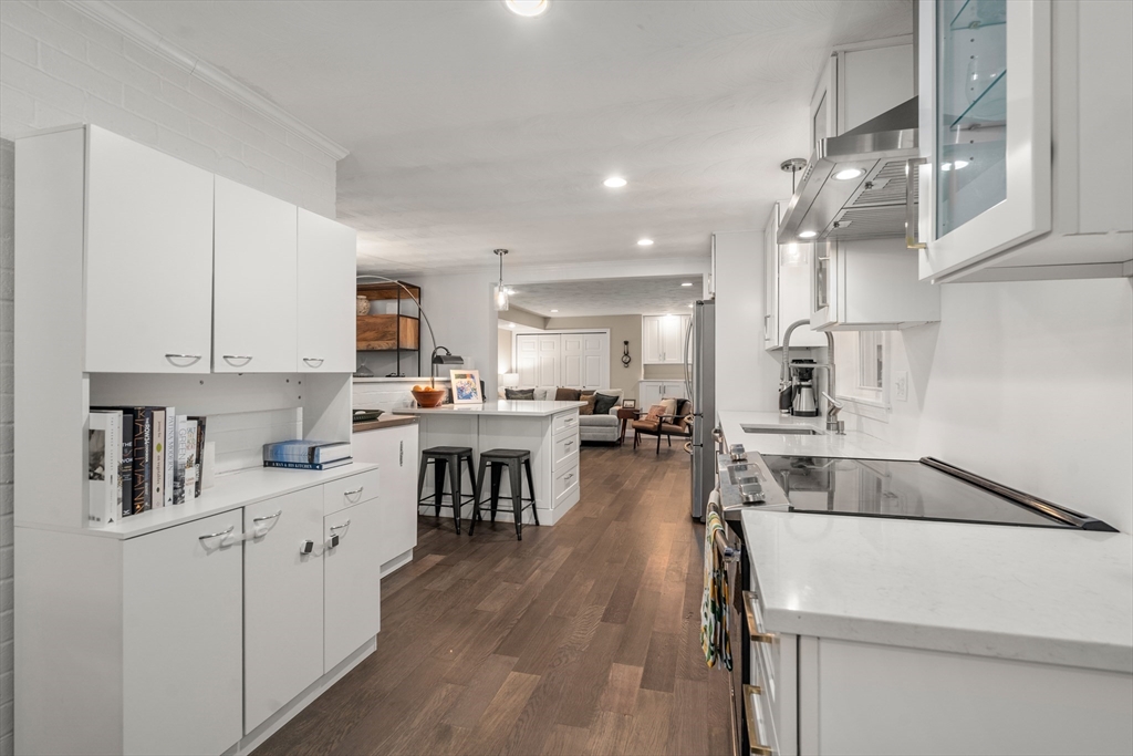 62 Gregory Road Framingham, MA 01701 - Photo 10 of 42 a kitchen with a sink a stove and cabinets