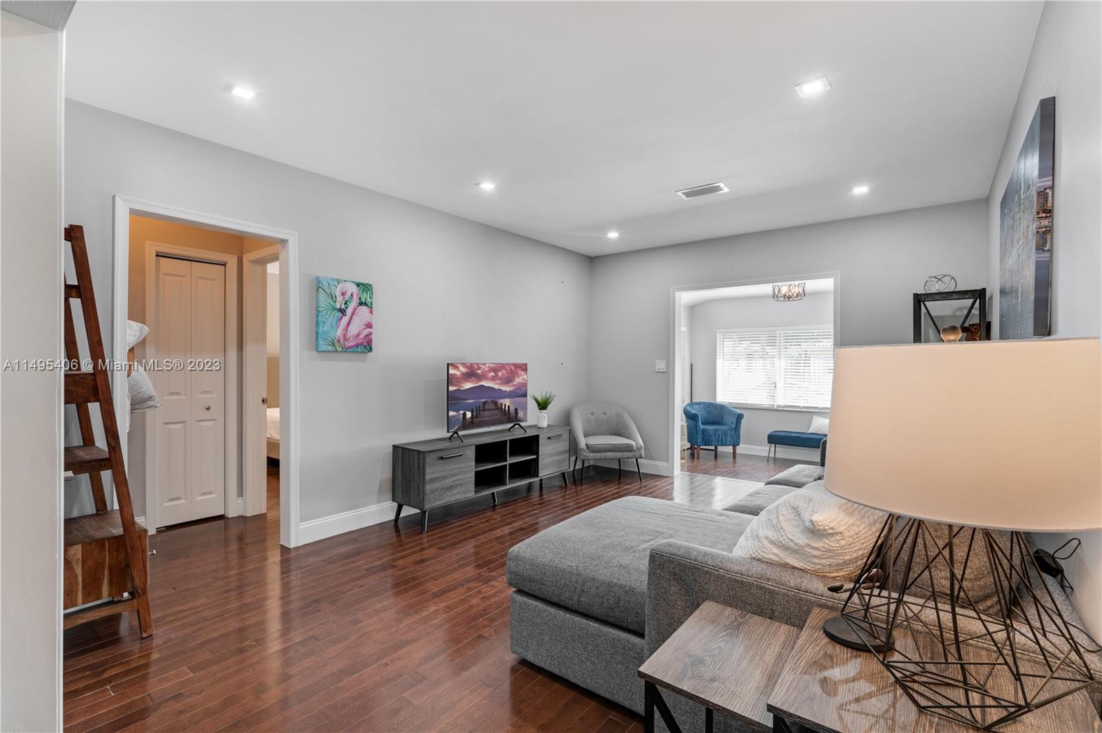 2465 Southwest 21st Terrace Miami, FL 33145 - Photo 11 of 45 a living room with furniture and a wooden floor