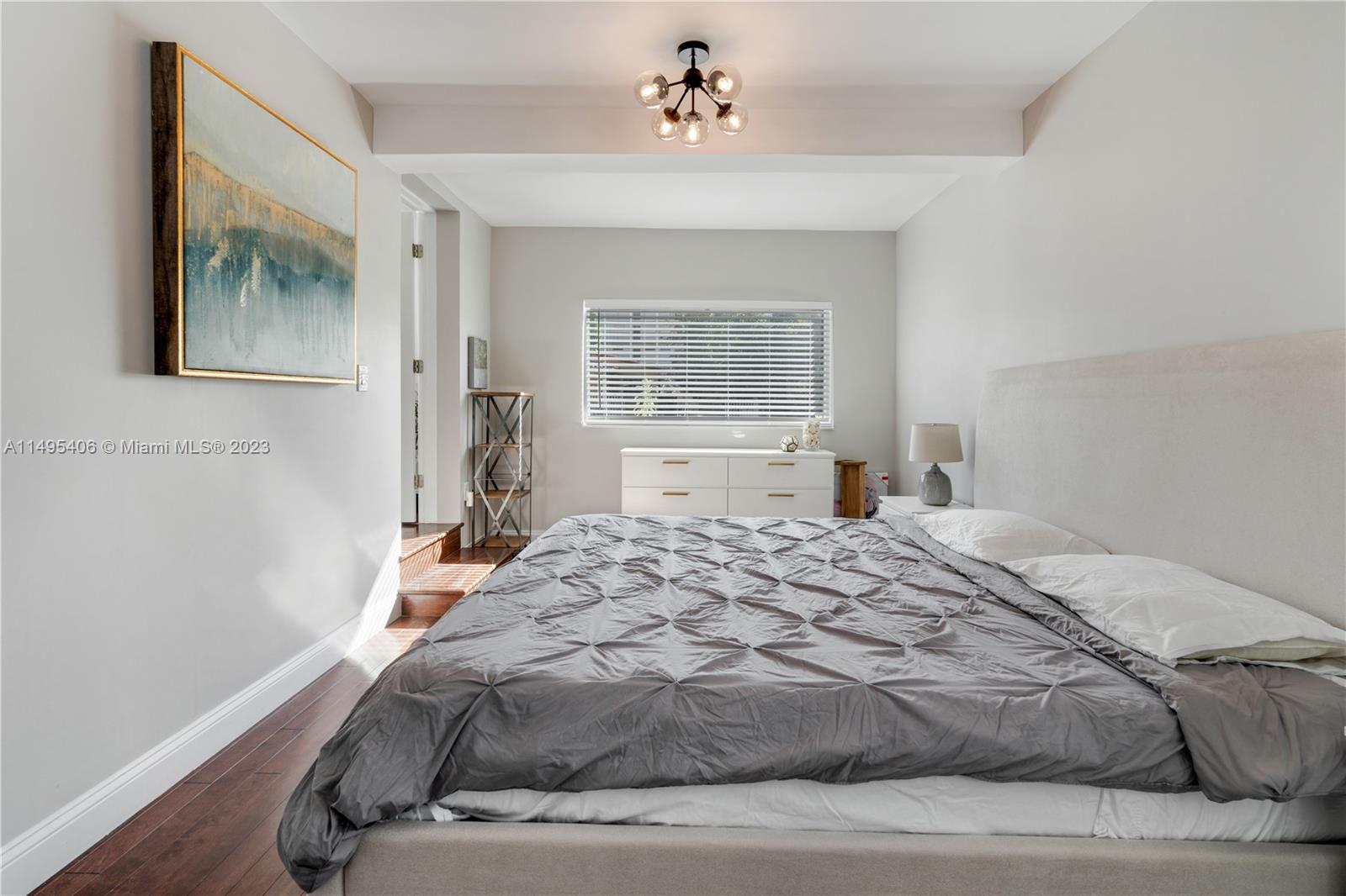 2465 Southwest 21st Terrace Miami, FL 33145 - Photo 19 of 45 a bedroom with a bed and a window