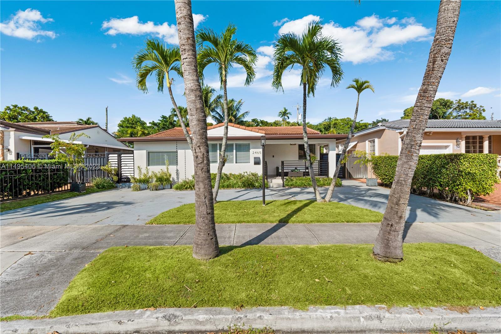 2465 Southwest 21st Terrace Miami, FL 33145 - Photo 2 of 45 a front view of a house with garden and porch