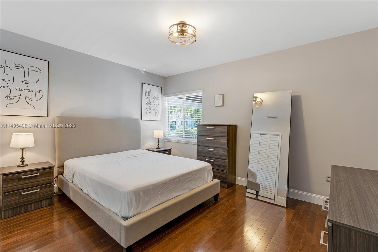 2465 Southwest 21st Terrace Miami, FL 33145 - Photo 24 of 45 a bedroom with a bed and a table