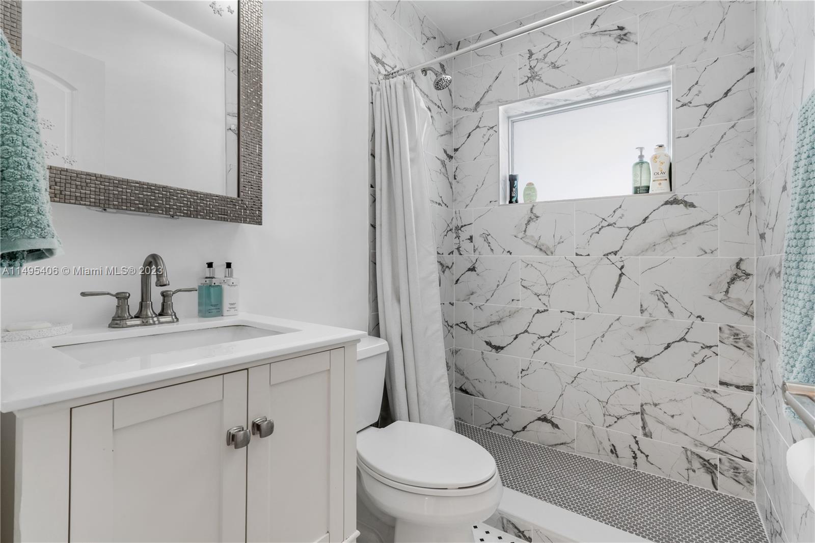 2465 Southwest 21st Terrace Miami, FL 33145 - Photo 25 of 45 a bathroom with a sink toilet and shower
