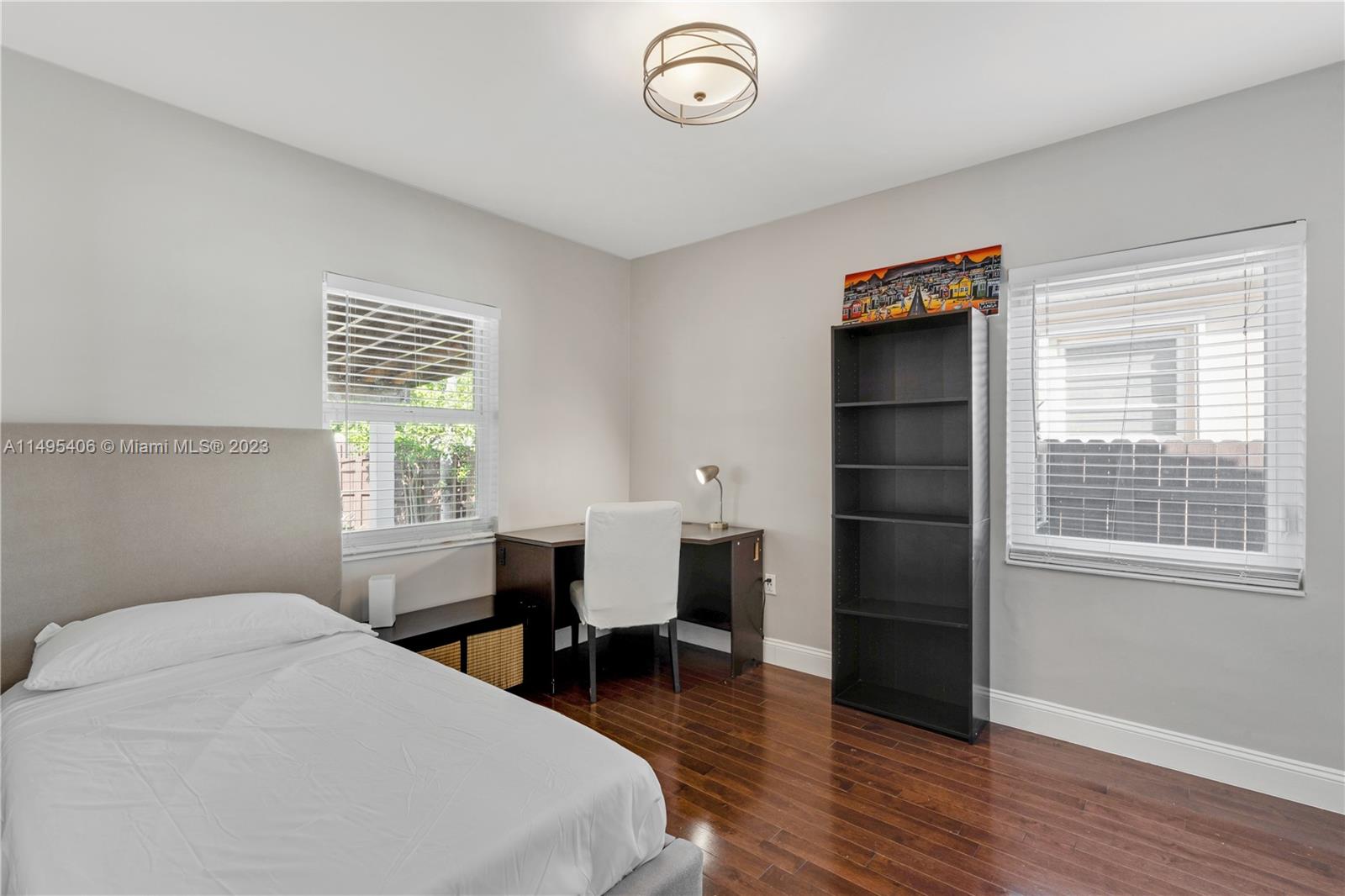 2465 Southwest 21st Terrace Miami, FL 33145 - Photo 26 of 45 a bedroom with a bed and a table in it