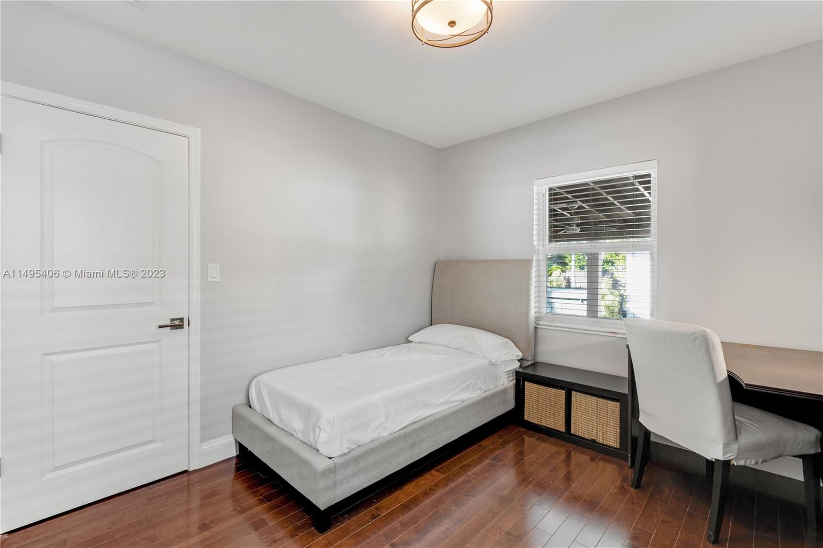 2465 Southwest 21st Terrace Miami, FL 33145 - Photo 27 of 45 a bedroom with a bed window and a desk