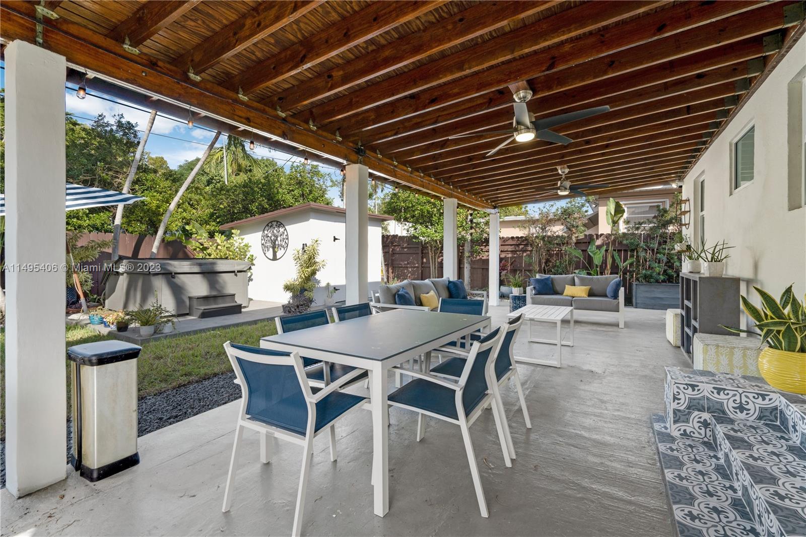 2465 Southwest 21st Terrace Miami, FL 33145 - Photo 29 of 45 a view of a patio with table and chairs and potted plants