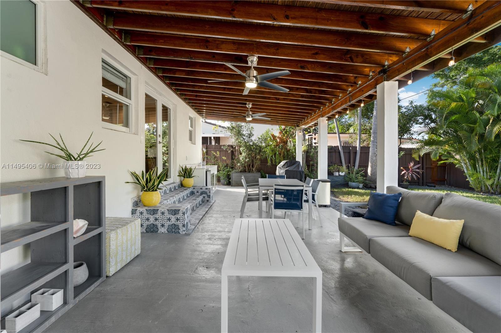 2465 Southwest 21st Terrace Miami, FL 33145 - Photo 31 of 45 a view of a patio with couches and potted plants