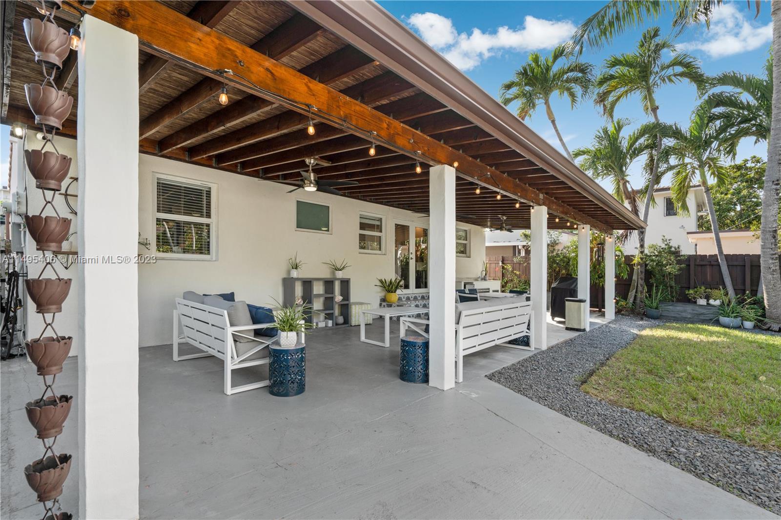 2465 Southwest 21st Terrace Miami, FL 33145 - Photo 33 of 45 a view of a patio with table and chairs and potted plants