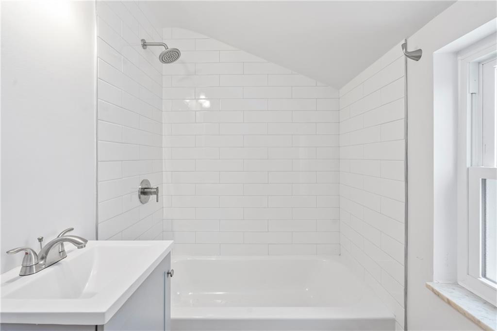 2041 Lindsay Road Pittsburgh, PA 15221 - Photo 14 of 24 a white bath tub sitting next to a white sink