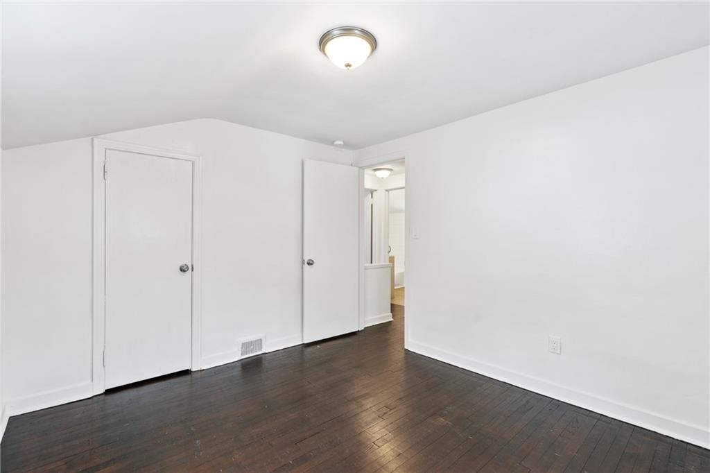 2041 Lindsay Road Pittsburgh, PA 15221 - Photo 16 of 24 a view of an empty room with wooden floor