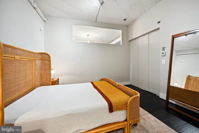 a bedroom with a bed and a desk