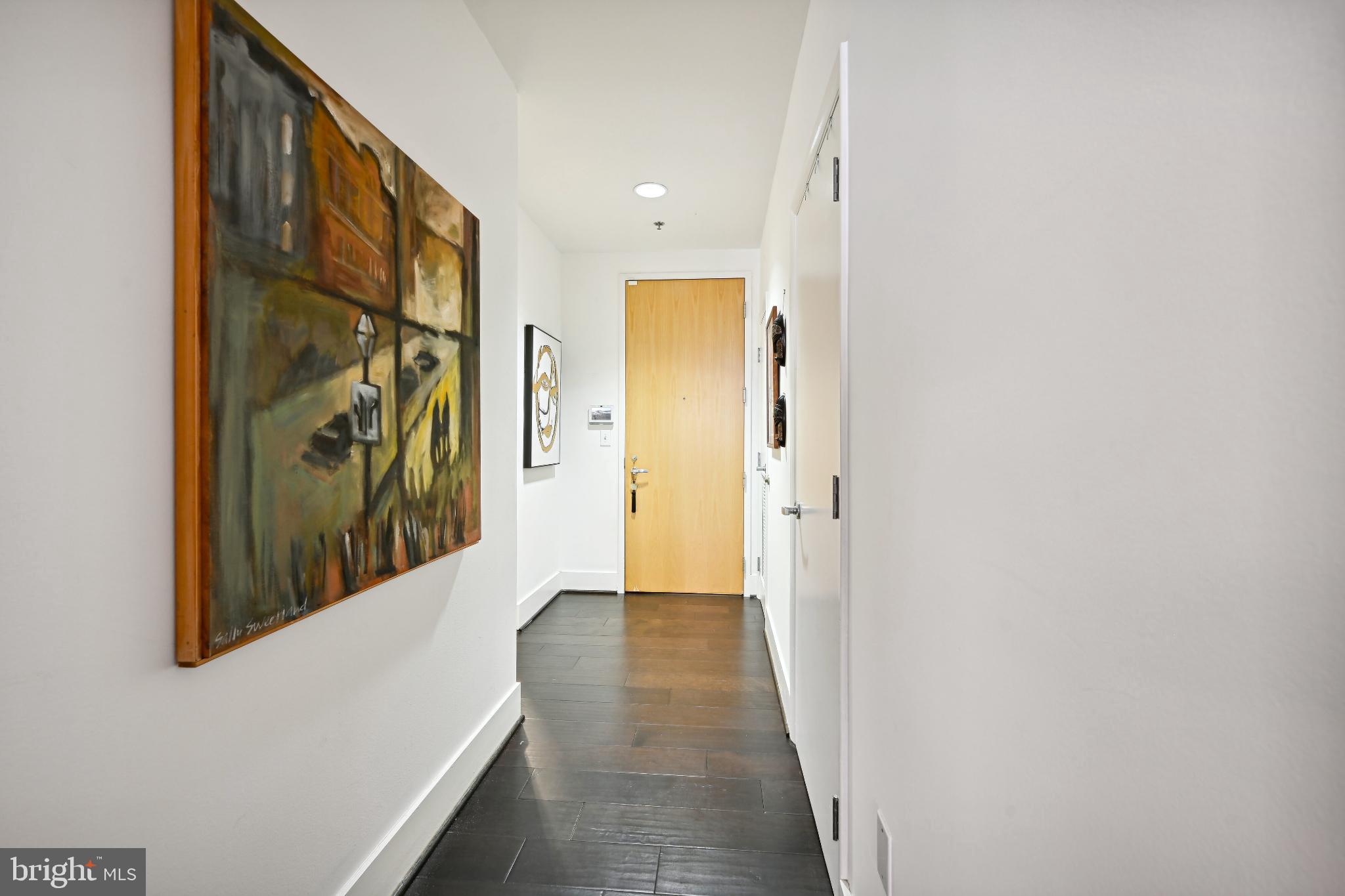 1700 Kalorama Road Northwest, Unit 207 Washington, DC 20009 - Photo 16 of 40 a view of a hallway with wooden floor