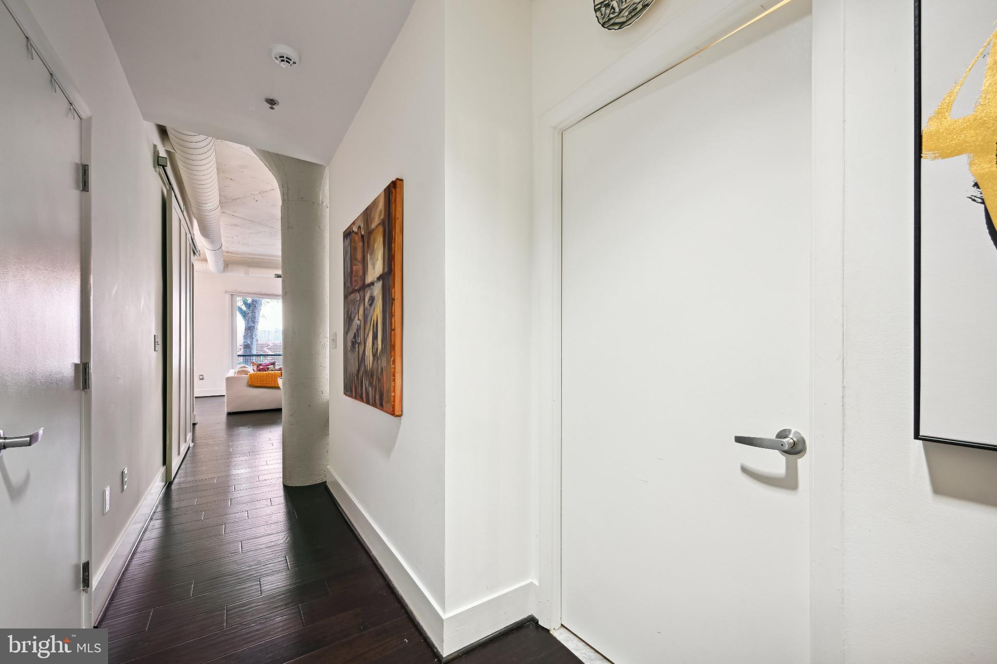 1700 Kalorama Road Northwest, Unit 207 Washington, DC 20009 - Photo 17 of 40 a view of a hallway with wooden floor
