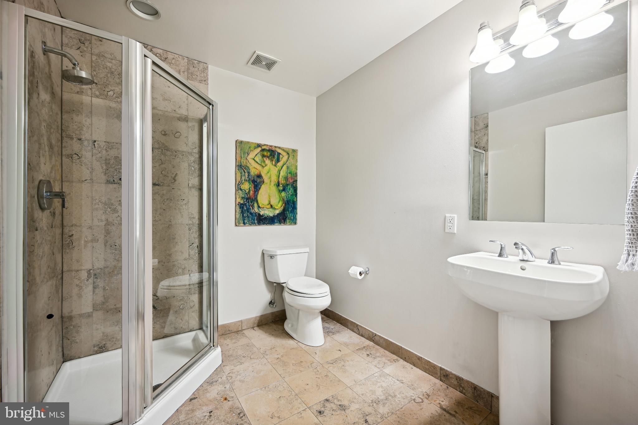1700 Kalorama Road Northwest, Unit 207 Washington, DC 20009 - Photo 20 of 40 a bathroom with a sink a toilet and shower
