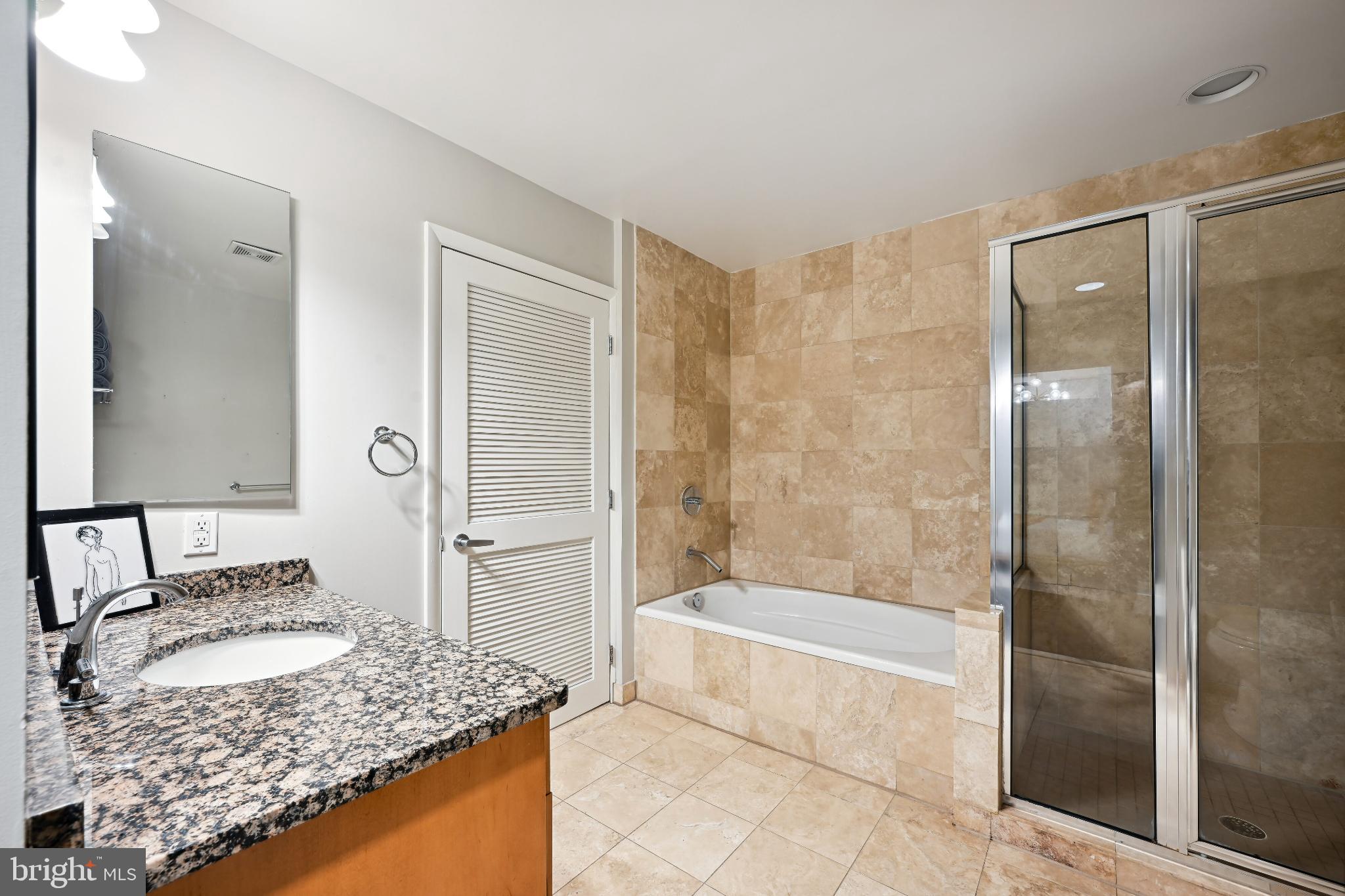 1700 Kalorama Road Northwest, Unit 207 Washington, DC 20009 - Photo 24 of 40 a bathroom with a granite countertop sink and a mirror