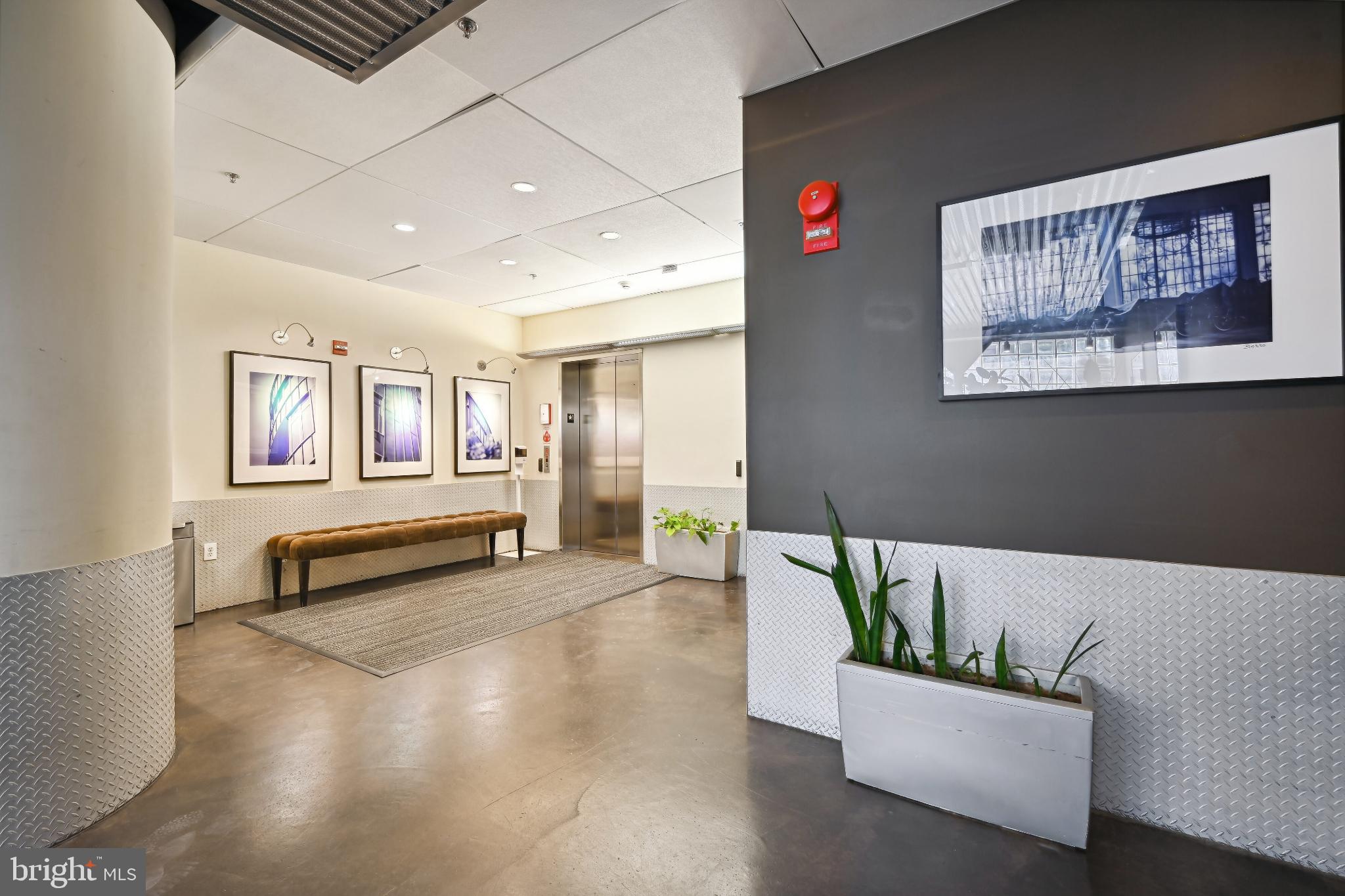 1700 Kalorama Road Northwest, Unit 207 Washington, DC 20009 - Photo 27 of 40 a living room with furniture and a wooden floor